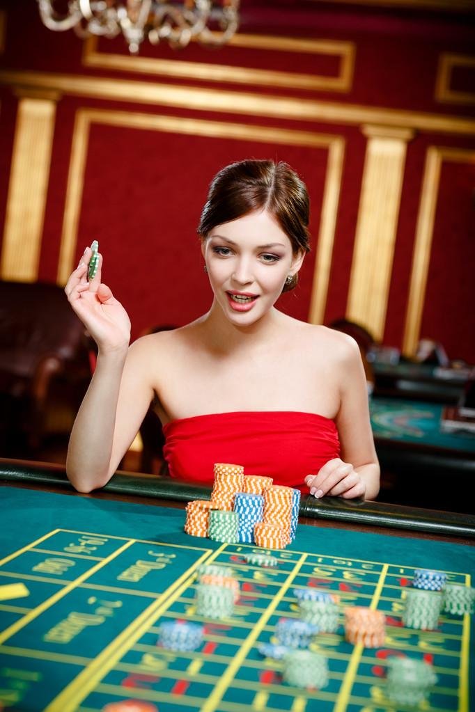 Croupier confirming winning number and settling bets
